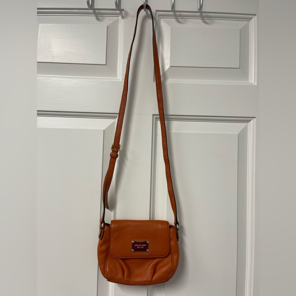 Excellent used condition cognac brown leather Michael Kors crossbody purse